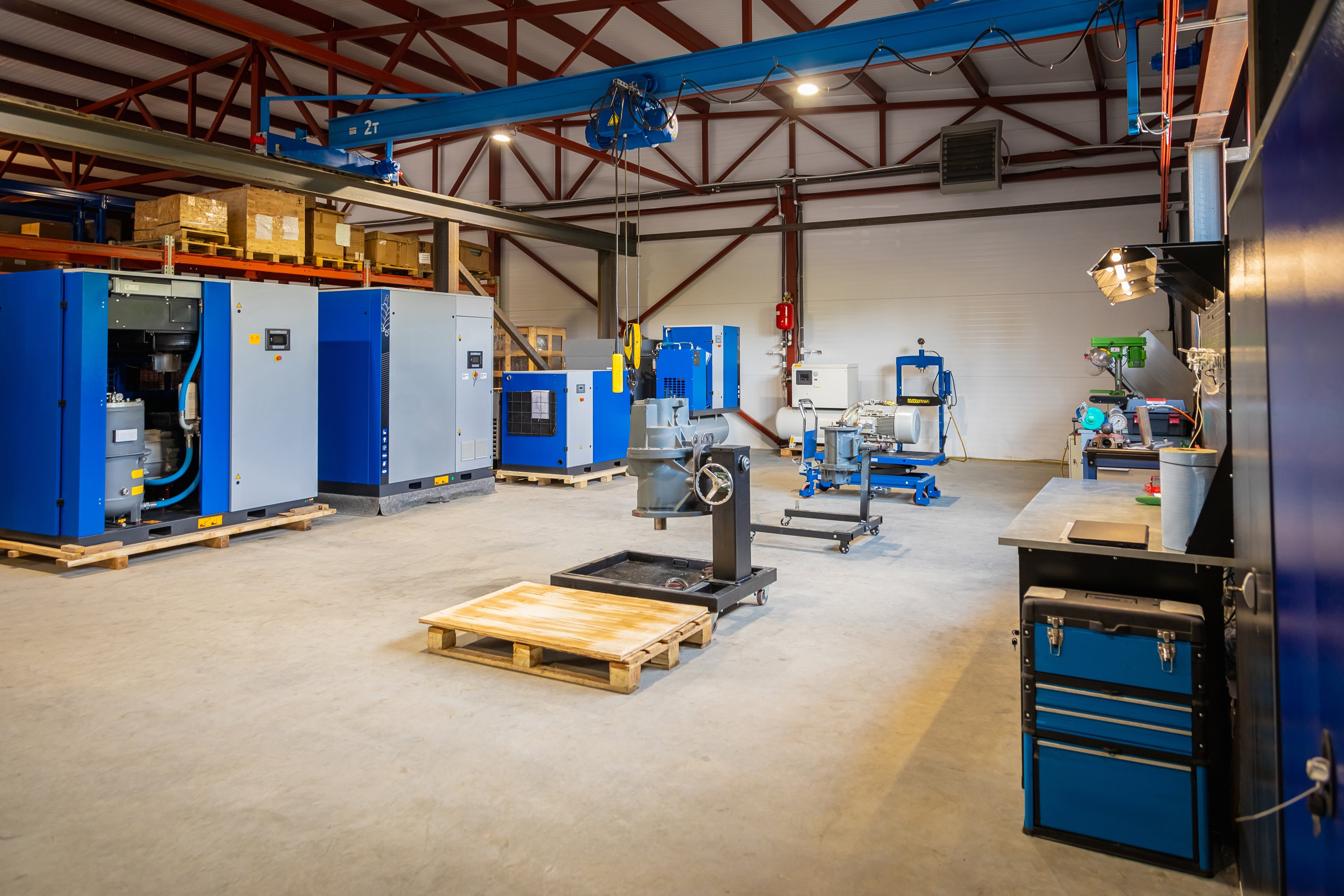 neat and organized factory floor with air compressors on pallets